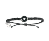 This black macrame bracelet is hand braided using 100% recycled plastic cord. Designed to represent the tires we’re recovering from the Osborne Reef, the tire-shaped bezel is filled with verified 100% crumb rubber from tires that our crews recovered directly from the Osborne Reef