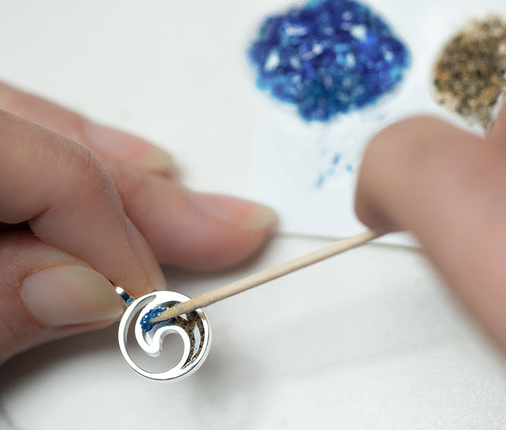 A Dune Bali Necklace being hand assembled.