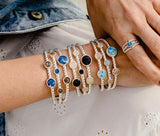 A person wearing a set of Dune Bracelets