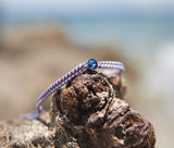 Ocean Drop Bracelet - Red, White, and Blue - on drift wood