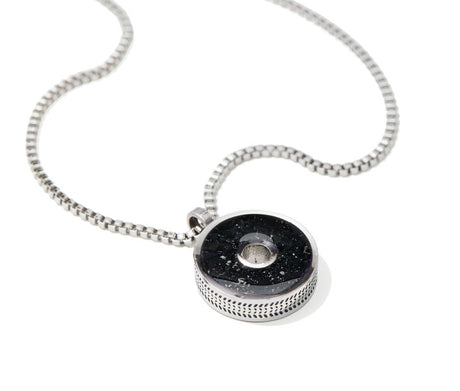 This 18” box chain necklace is made from recycled stainless steel. Designed to represent the tires we’re recovering from the Osborne Reef, the tire-shaped pendant is filled with verified 100% crumb rubber from tires that our crews recovered directly from the Osborne Reef. 