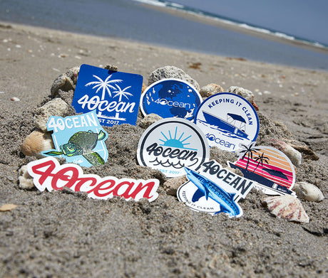 Collection of stickers in the sand on the beach